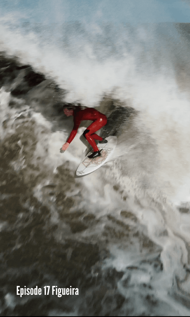 london in red wetsuit pulling into a barrel