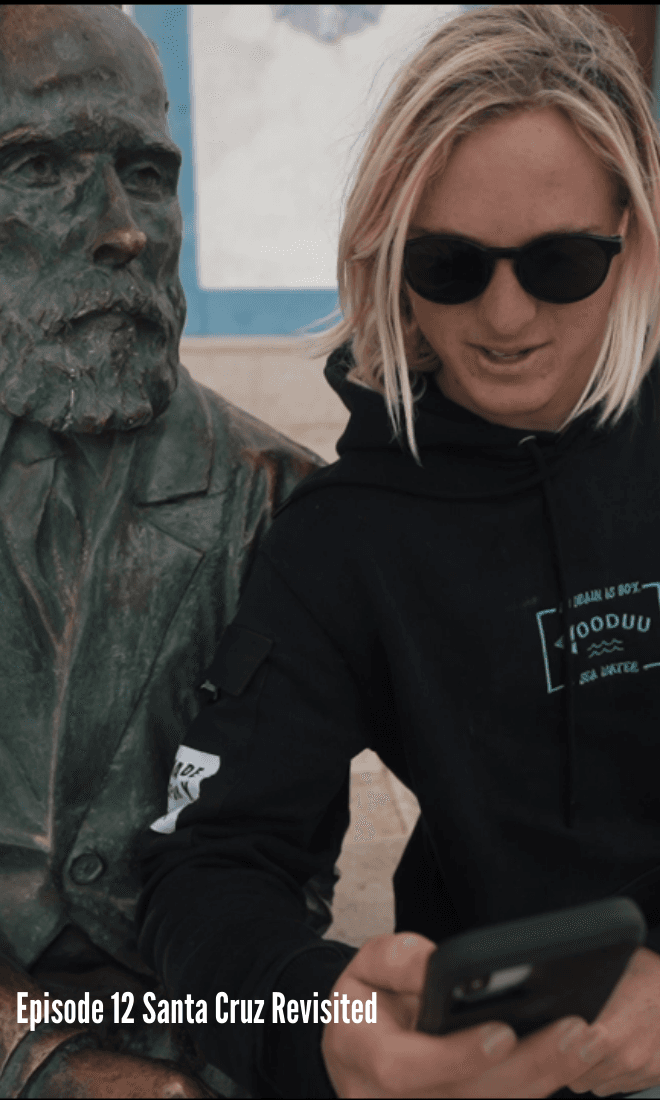 london posing next to bronze statue