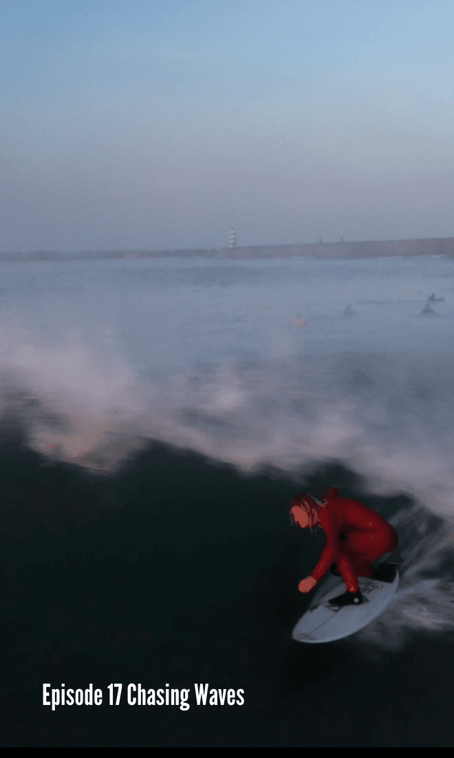london in red wetsuit pulling into a barrel