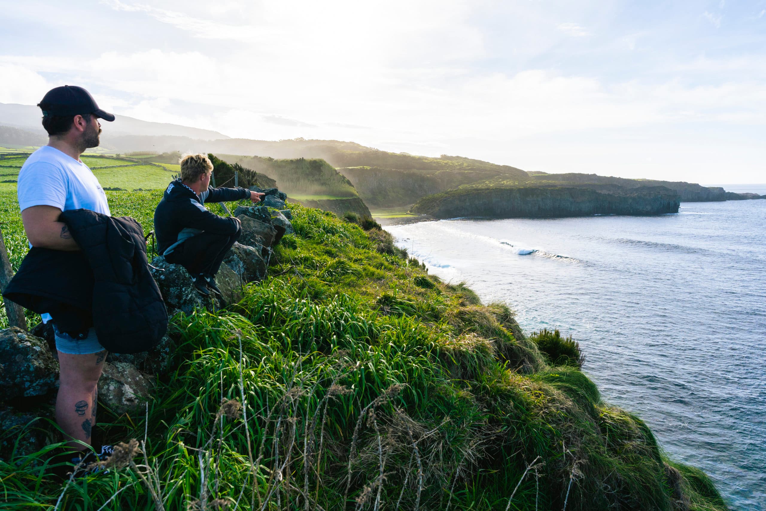 london crouching on cliff edge in the acores